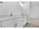 Modern bathroom featuring double sinks, quartz countertops, and elegant fixtures in a clean design at 937 Old Welcome Rd, Lithia, FL 33547