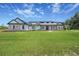 Inviting single-Gathering home featuring a manicured lawn and a charming front porch at 937 Old Welcome Rd, Lithia, FL 33547