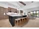 Spacious kitchen with large island, stainless appliances, and seating, perfect for entertaining at 937 Old Welcome Rd, Lithia, FL 33547