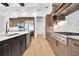 Modern kitchen with island, stainless steel appliances, custom cabinets, and designer finishes at 937 Old Welcome Rd, Lithia, FL 33547