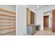 Bright office space with a built-in desk, storage cabinets, walk-in pantry, and sliding barn door at 937 Old Welcome Rd, Lithia, FL 33547