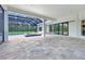 Covered pool and spa area with stone pavers, ideal for relaxation and recreation at 937 Old Welcome Rd, Lithia, FL 33547