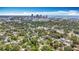 A wide aerial view of the area shows residential area among mature trees at 1011 Newton S Ave, St Petersburg, FL 33705