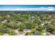 A broad aerial of the property in a neighborhood of mature trees at 1011 Newton S Ave, St Petersburg, FL 33705