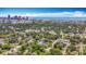 A wide aerial view displays property among mature trees, skyline, and waterways at 1011 Newton S Ave, St Petersburg, FL 33705