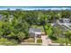Aerial view of a charming home with lush landscaping and a well-maintained yard at 1011 Newton S Ave, St Petersburg, FL 33705