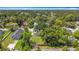 Aerial view of a neighborhood showcasing lush greenery and various rooftops, highlighting the community's setting at 1011 Newton S Ave, St Petersburg, FL 33705