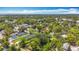 Wide aerial view of property with mature trees and residential area around it at 1011 Newton S Ave, St Petersburg, FL 33705