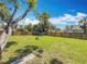 Spacious backyard with a well-kept lawn and a sturdy wooden fence, ideal for outdoor activities at 1011 Newton S Ave, St Petersburg, FL 33705