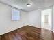Bedroom boasting wood floors, natural light, and a neutral color palette at 1011 Newton S Ave, St Petersburg, FL 33705