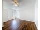 Bedroom showcasing wood floors and neutral walls, illuminated by a ceiling fan at 1011 Newton S Ave, St Petersburg, FL 33705