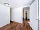 Bedroom with hardwood flooring, view of closet, and doorway to another room at 1011 Newton S Ave, St Petersburg, FL 33705
