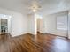 Spacious bedroom with wood floors, a ceiling fan, and ample natural light at 1011 Newton S Ave, St Petersburg, FL 33705