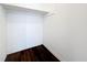 Small closet space with white walls, minimal trim, and dark-colored hardwood floors at 1011 Newton S Ave, St Petersburg, FL 33705