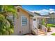 View of a house with a new roof, stucco siding, and decorative stone facade at 1011 Newton S Ave, St Petersburg, FL 33705
