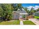 Home with manicured front lawn, stone accents, and a cozy entryway at 1011 Newton S Ave, St Petersburg, FL 33705