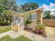 Well-maintained home with stone accents, a quaint front porch, and a neatly landscaped yard at 1011 Newton S Ave, St Petersburg, FL 33705