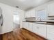 Kitchen showcases white cabinets, granite countertops, and stainless steel sink at 1011 Newton S Ave, St Petersburg, FL 33705