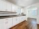 Bright kitchen with white cabinets, granite countertops, stainless appliances, and subway tile backsplash at 1011 Newton S Ave, St Petersburg, FL 33705