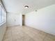 Bright living room with neutral tile flooring and a large window for natural light at 1011 Newton S Ave, St Petersburg, FL 33705