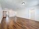 Bright living room with wood-look flooring, fresh paint, and multiple access points at 1011 Newton S Ave, St Petersburg, FL 33705