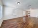 Light-filled living room boasts hardwood floors and large windows at 1011 Newton S Ave, St Petersburg, FL 33705