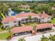 Beautiful aerial shot of a condo building near a lake with covered parking spaces at 10330 Carrollwood Ln # 95, Tampa, FL 33618