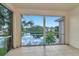 Relaxing balcony with comfortable seating and a scenic view of the tranquil lake at 10330 Carrollwood Ln # 95, Tampa, FL 33618