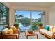 Relaxing balcony with comfortable seating and a scenic view of the tranquil lake at 10330 Carrollwood Ln # 95, Tampa, FL 33618