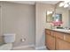 Bathroom featuring a single sink vanity and toilet at 10330 Carrollwood Ln # 95, Tampa, FL 33618