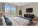 Bedroom featuring a bed, dresser, and a television at 10330 Carrollwood Ln # 95, Tampa, FL 33618