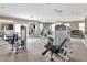 Well-equipped gym with modern exercise machines and ample natural light at 10330 Carrollwood Ln # 95, Tampa, FL 33618