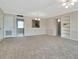 Bright and airy living space featuring an open layout, with a partial view of the kitchen at 10330 Carrollwood Ln # 95, Tampa, FL 33618