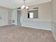 Neutral living area with elegant paneling and an open view to the adjacent space at 10330 Carrollwood Ln # 95, Tampa, FL 33618