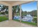 Beautiful view of the lake from this tiled sunroom surrounded by lots of trees at 10330 Carrollwood Ln # 95, Tampa, FL 33618