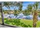 Beautiful view of the water with the blue sky and clouds reflecting in the lake at 10330 Carrollwood Ln # 95, Tampa, FL 33618