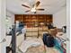 Bedroom with large built-in shelves and storage and packed up moving boxes at 10502 Lake Williams Dr, Odessa, FL 33556