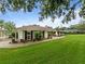 Well-maintained home with green lawn and manicured landscaping along the front walk at 10502 Lake Williams Dr, Odessa, FL 33556