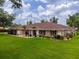 Charming single-story home with a well-manicured lawn and beautiful landscaping at 10502 Lake Williams Dr, Odessa, FL 33556