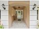 Inviting entryway with stylish lighting and a welcoming front door at 10502 Lake Williams Dr, Odessa, FL 33556