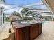Spa with views of the pool and backyard through screened-in pool enclosure at 10502 Lake Williams Dr, Odessa, FL 33556