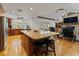 Spacious kitchen with granite countertops, stainless steel appliances, and a large island with bar seating at 10502 Lake Williams Dr, Odessa, FL 33556