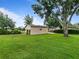 Outbuilding on a sprawling green lot, perfect for workshop or storage at 10502 Lake Williams Dr, Odessa, FL 33556