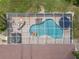 Overhead view of screened pool and hot tub, complete with backyard lounging furniture at 10502 Lake Williams Dr, Odessa, FL 33556