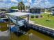 Waterfront home with well-maintained landscaping, boat lift, and canal access at 108 W Saint Annes Cir, Apollo Beach, FL 33572