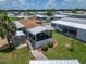 Aerial view highlighting the home's screened in patio at 108 W Saint Annes Cir, Apollo Beach, FL 33572