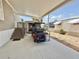 Carport featuring a golf cart, adjacent storage shed, and access to covered stairs at 108 W Saint Annes Cir, Apollo Beach, FL 33572