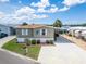 Well-maintained home with a covered carport and beautiful landscaping at 108 W Saint Annes Cir, Apollo Beach, FL 33572