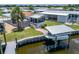 Waterfront home featuring screened lanai, boat dock, and lift at 108 W Saint Annes Cir, Apollo Beach, FL 33572