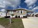 Charming home with a well-maintained lawn, mailbox and tidy landscaping, offering great curb appeal at 108 W Saint Annes Cir, Apollo Beach, FL 33572